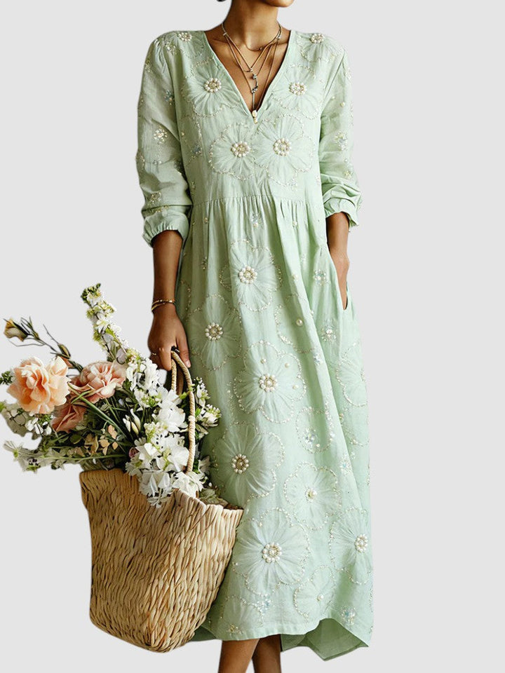 Floral midi dress by Emma & Rose Cape Town featuring a feminine design with colorful flower patterns and a flowing silhouette.