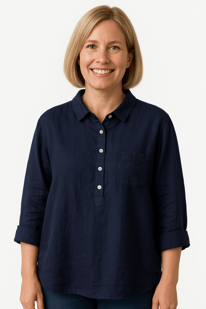 Elegant Naja™ blouse by Emma & Rose Cape Town featuring a stylish blue Petra design with intricate detailing.