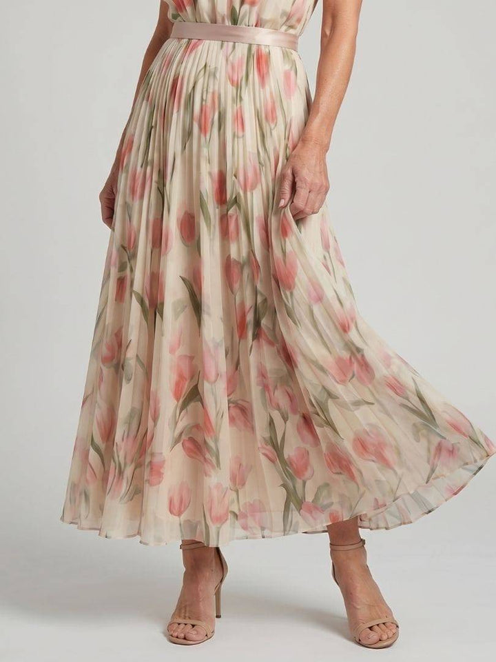 Emma & Rose Cape Town Aurelle™ halter neck floral midi dress with a fitted waist and flowing skirt, perfect for summer occasions.