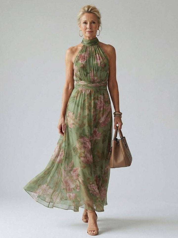 Emma & Rose Cape Town Mirelle™ gathered halter midi dress hanging on a display, showcasing its elegant gathered design and halter neckline.