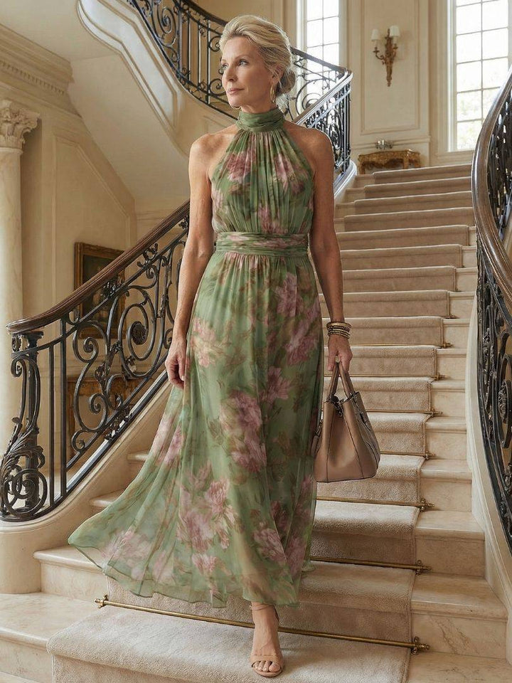 Emma & Rose Cape Town Mirelle gathered halter midi dress featuring a fitted bodice and flowing skirt in a soft, elegant fabric.