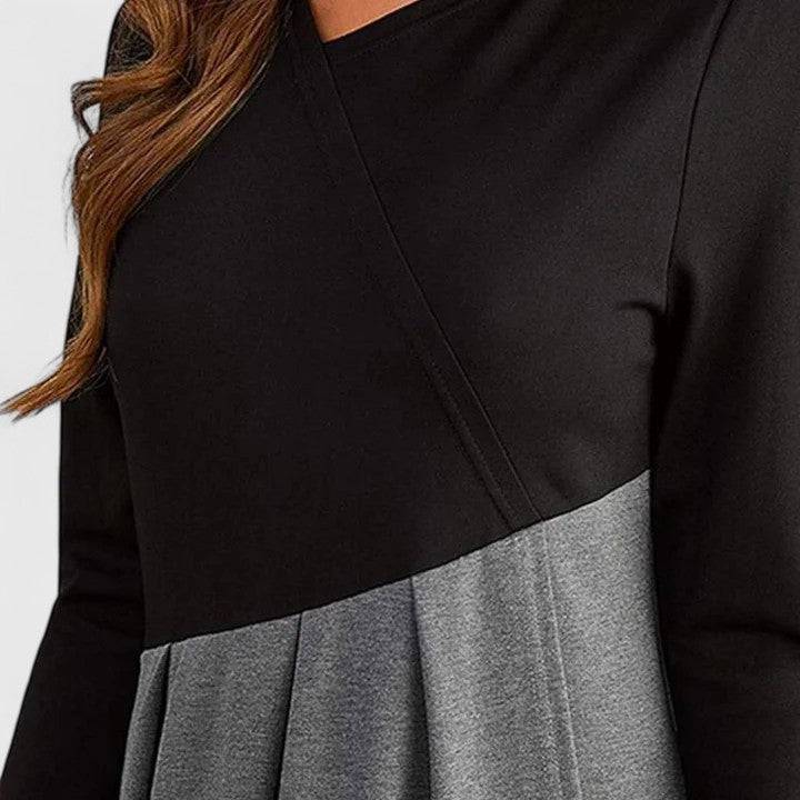 Elegant winter dress by Emma & Rose Cape Town featuring a stylish design, modeled by Rachel in a sophisticated look.