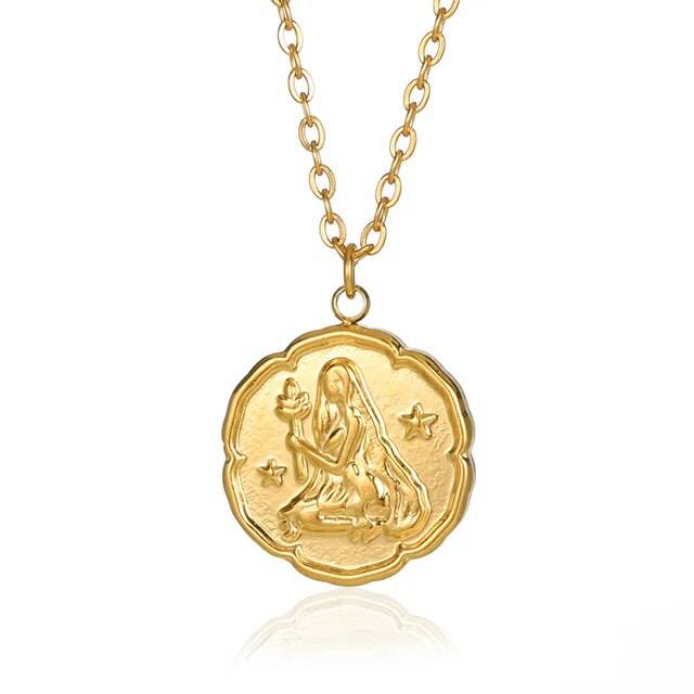 Gold zodiac sign necklace by Emma & Rose Manhattan featuring a round disc pendant with constellation design for women and men.