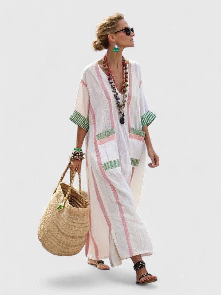 Elegant Kyvanna™ Maxi Dress by Emma & Rose Cape Town, flowing fabric and intricate design shown in the image.
