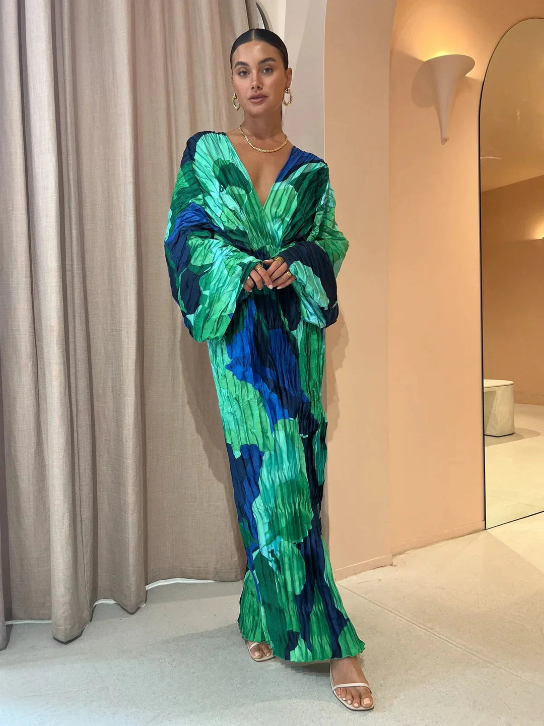 Elegant Eva™ pleated dress by Emma & Rose Cape Town, shown in a flowing design with pleats and stylish silhouette.