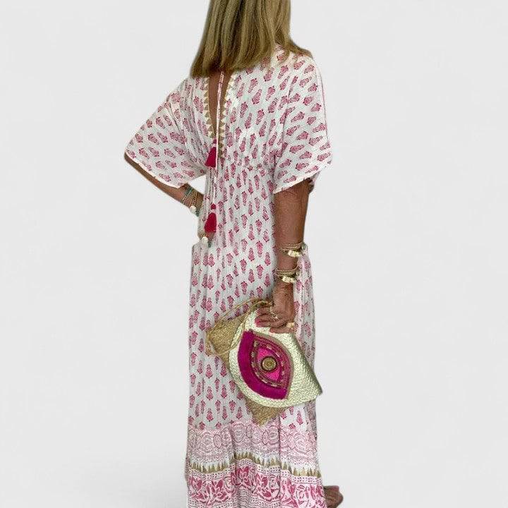 Lyrianna™ comfortable maxi dress by Emma & Rose Cape Town, featuring flowing fabric and relaxed fit, displayed on a model.