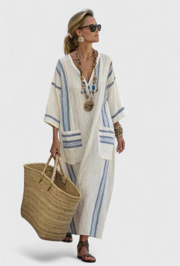 Elegant Kyvanna™ maxi dress by Emma & Rose Cape Town, flowing fabric, sleeveless design, and stylish neckline.
