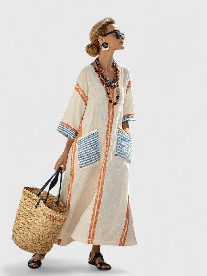 Elegant Kyvanna™ maxi dress by Emma & Rose Cape Town, featuring flowing fabric and a stylish design.