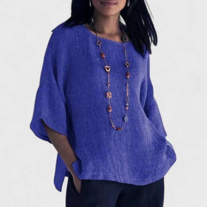 Mireille™ comfortable blouse by Emma & Rose Cape Town, soft fabric, long sleeves, and a relaxed fit, displayed on a hanger.