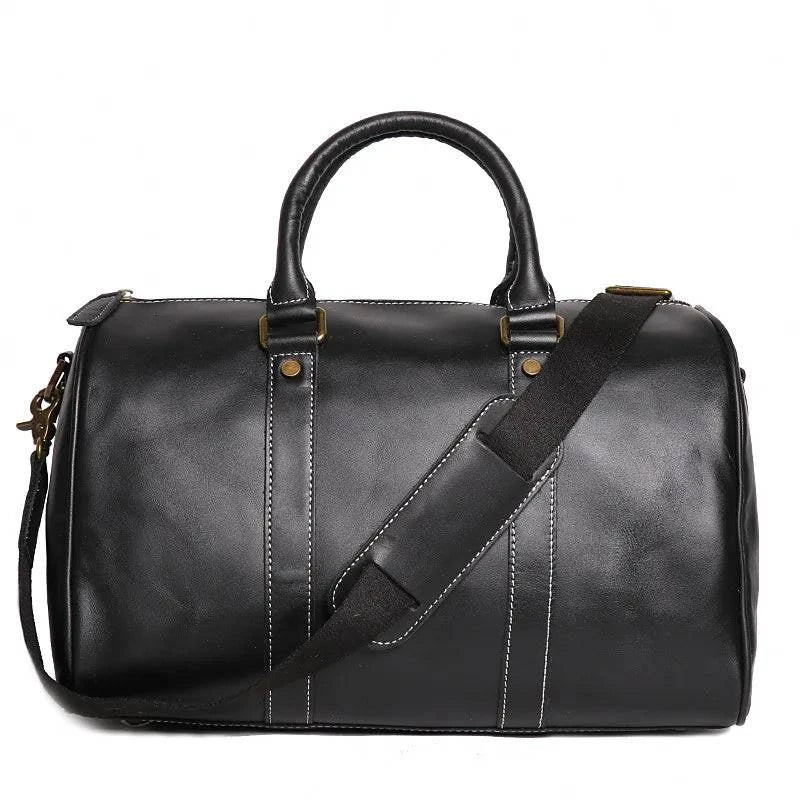 Emma & Rose Manhattan Riley™ Roma Duffle Bag in tan leather with handles and shoulder strap, showing front view and spacious interior