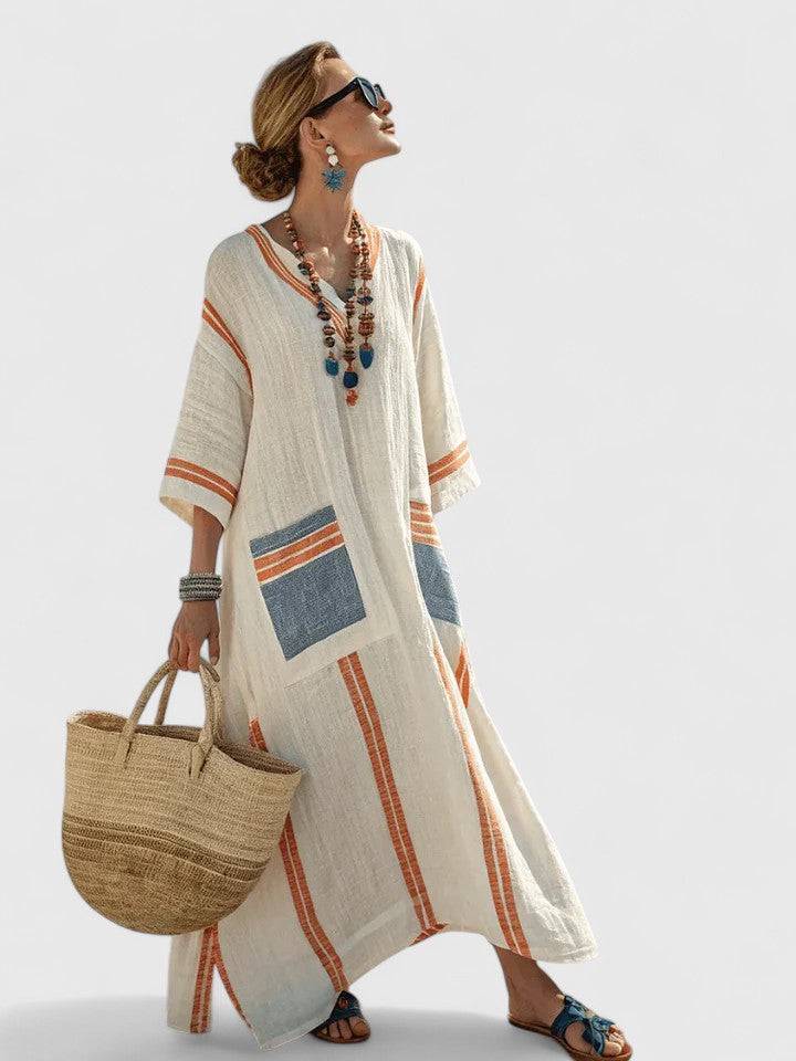 Elegant Kyvanna™ maxi dress by Emma & Rose Cape Town, featuring flowing fabric and a stylish design.
