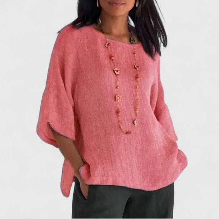 Mireille™ Emma & Rose Cape Town comfortable blouse with soft fabric and relaxed fit, displayed on a hanger.