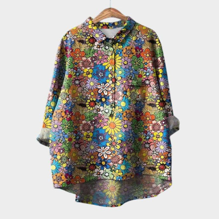 Elegant Sia™ blouse by Emma & Rose Cape Town, featuring a stylish, flowy design with a high neckline and intricate detailing.