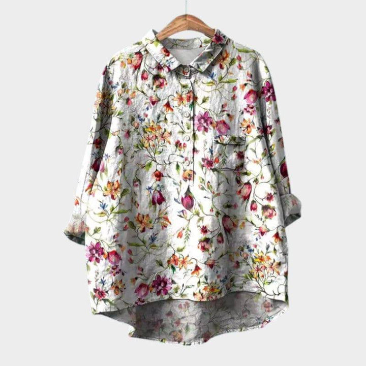 Elegant Sia™ blouse by Emma & Rose Cape Town featuring a stylish, flowing design with a high neckline and long sleeves.