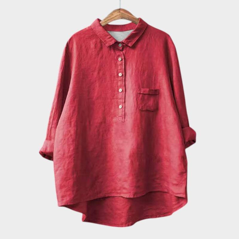 Elegant Emma & Rose Cape Town Naja™ blouse with long sleeves and intricate floral embroidery on soft fabric.
