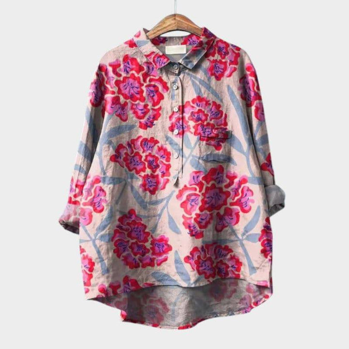 Elegant Ronja™ blouse by Emma & Rose Cape Town featuring a stylish design and soft fabric, displayed on a hanger.