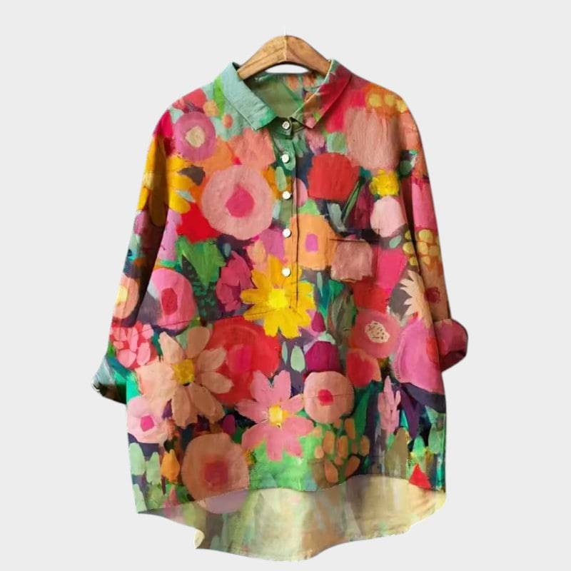 Elegant Saga™ blouse by Emma & Rose Cape Town, featuring a stylish, flowy design in soft fabric with a classic collar and button details.