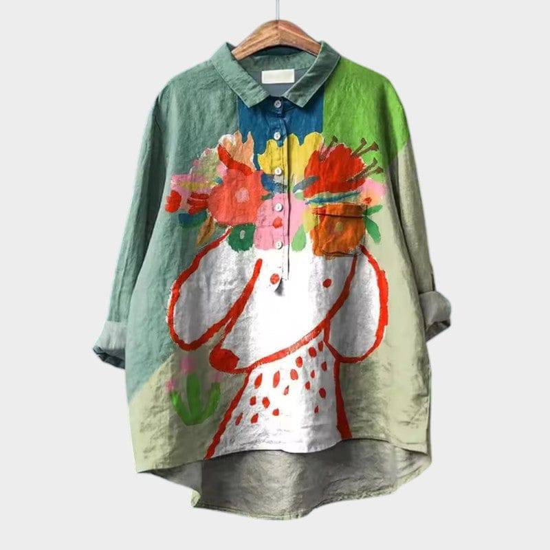 Elegant Milla™ blouse by Emma & Rose Cape Town, featuring a stylish design and lightweight fabric, shown on a hanger.
