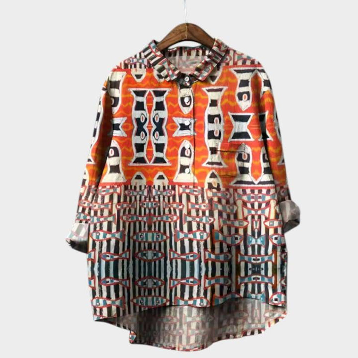 Elegant Siara™ blouse by Emma & Rose Cape Town, featuring a stylish, flowing design and intricate details, displayed on a white background.