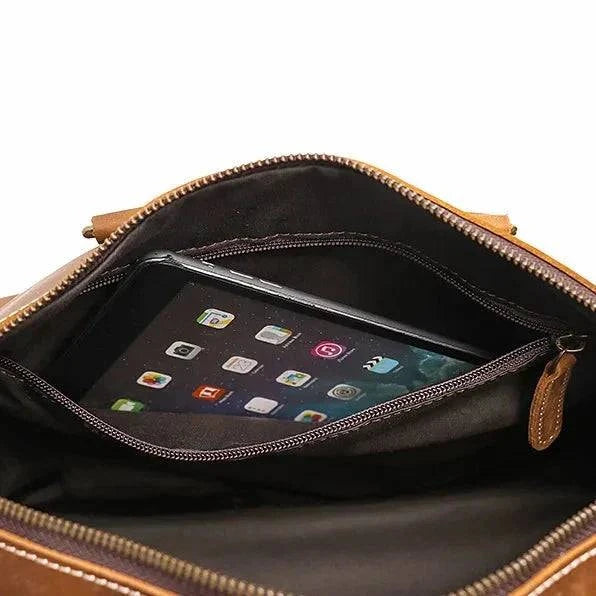 Emma & Rose Manhattan Riley™ Roma duffle bag with leather accents and spacious interior, shown in black with sturdy handles.
