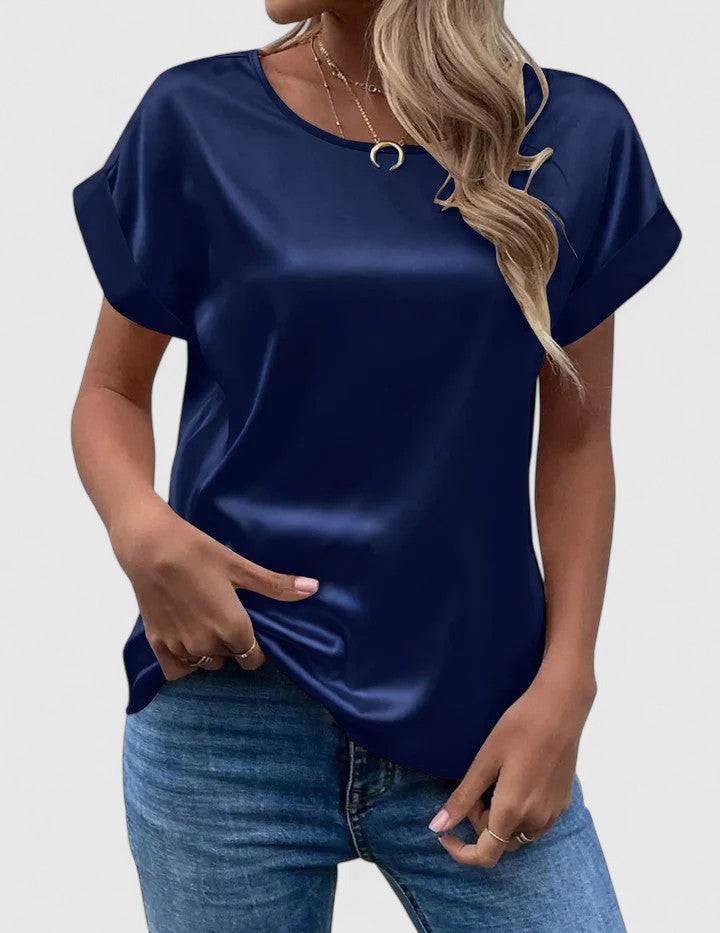 Elegant Lioraine™ blouse by Emma & Rose Cape Town, shown in a stylish, flowing fabric with a classic neckline.