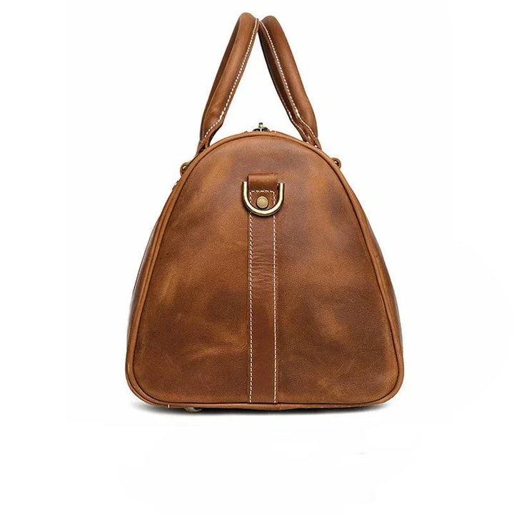 Emma & Rose Manhattan Riley™ Roma Duffle Bag in tan leather with handles and zipper closure, stylish travel and gym bag.