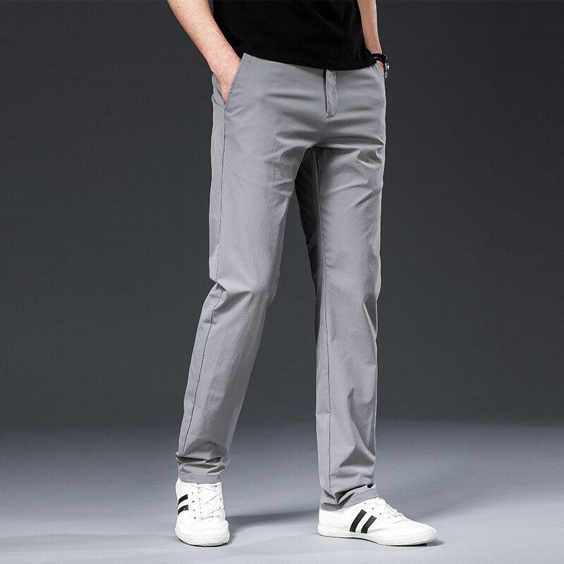 Emma & Rose Manhattan Parker™ Hamz chino pants in a neutral color, displayed flat with front pockets and belt loops.