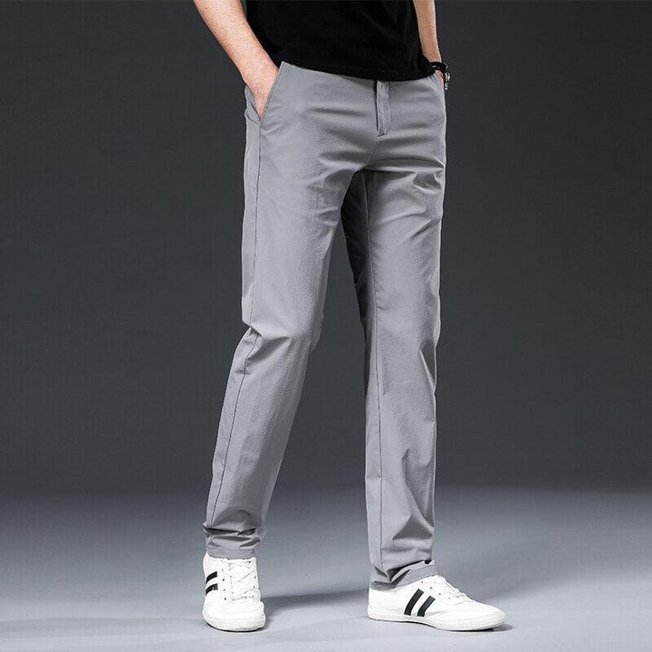 Emma & Rose Manhattan Parker™ Hamz chino pants in a neutral color, displayed flat with front pockets and belt loops.