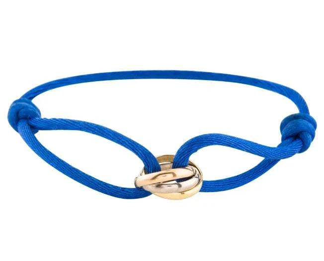 Emma & Rose Manhattan Ryan Golden Trifecta Bracelet featuring layered gold-toned chains and delicate charm accents.