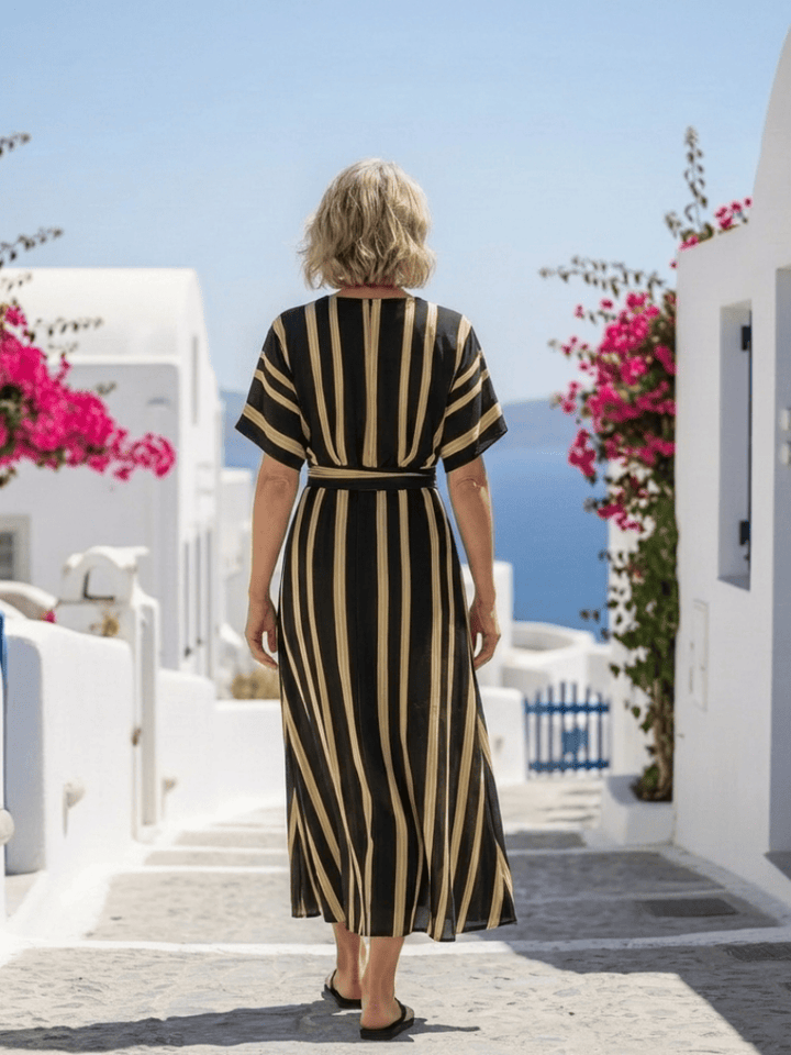 Emma & Rose Cape Town Lina™ striped wrap midi dress with short sleeves and V-neck, featuring a stylish, fitted waist.