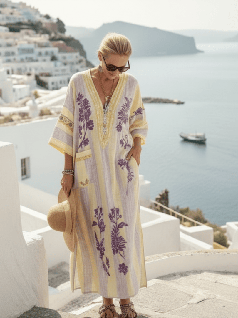 Aurelia™ striped floral maxi dress by Emma & Rose Cape Town, flowing fabric with colorful floral and striped pattern.