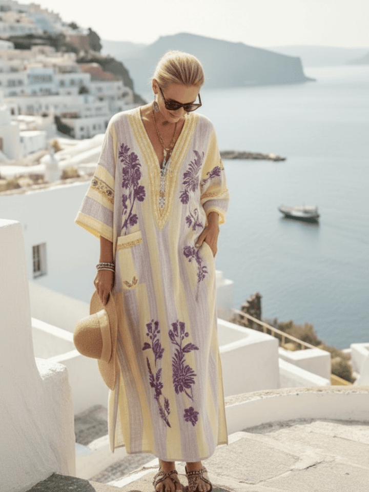 Aurelia™ striped floral maxi dress by Emma & Rose Cape Town, flowing fabric with colorful floral and striped pattern.