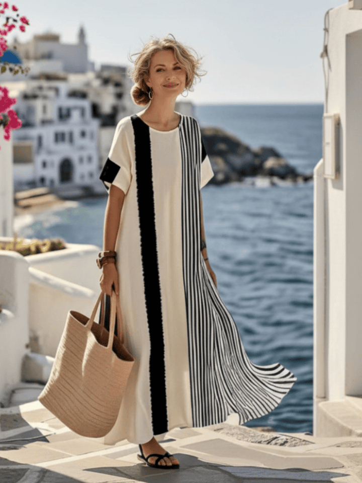 Emma & Rose Cape Town Elara™ striped maxi dress with long sleeves, flowing fabric, and a stylish, fitted silhouette.