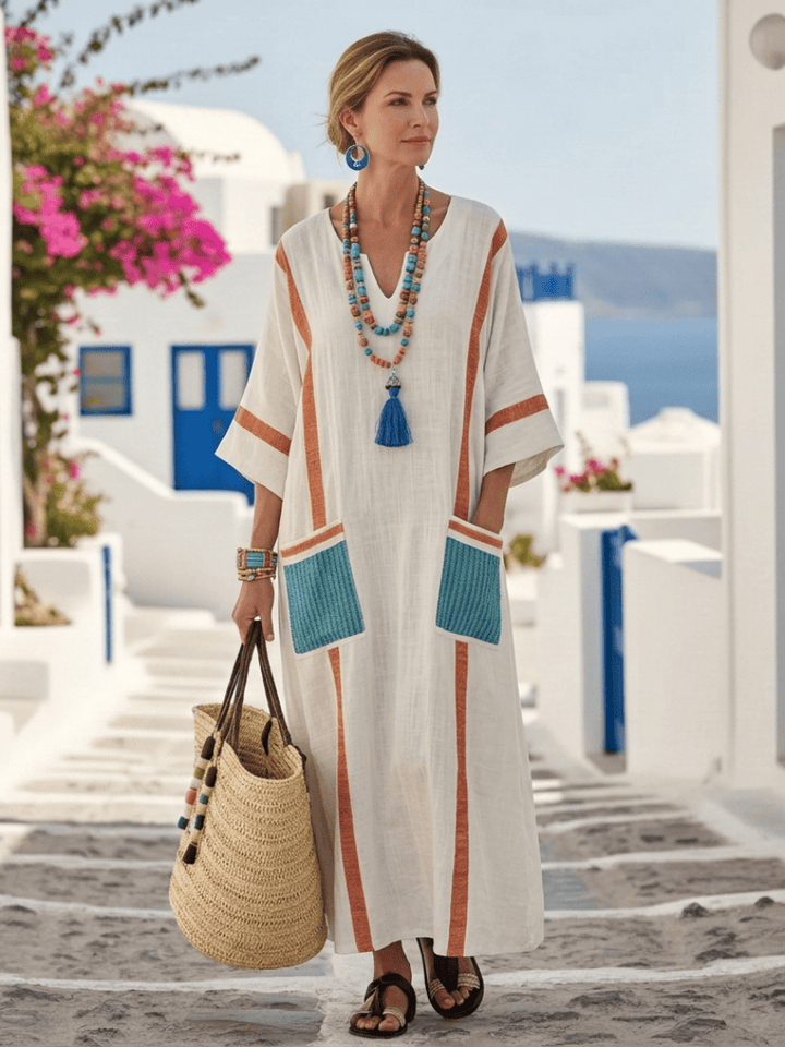 Noemi™ sleeve pocket maxi dress by Emma & Rose Cape Town, featuring a flowing fabric and stylish pocket details.