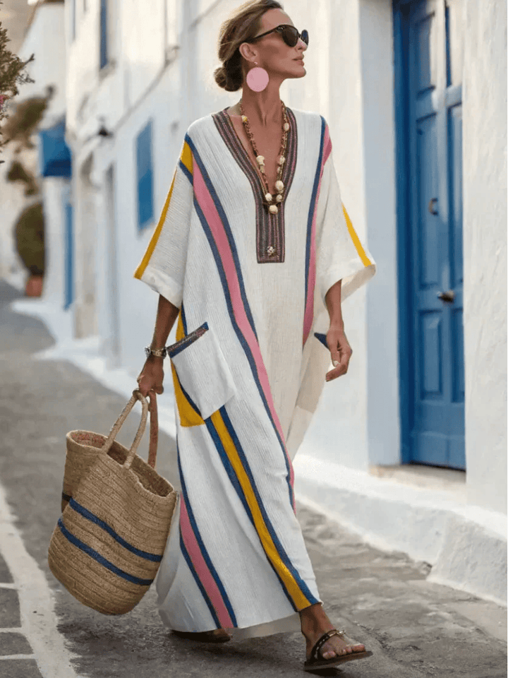 Noemi™ sleeve pocket maxi dress by Emma & Rose Cape Town, featuring a flowing fabric and stylish pocket details.