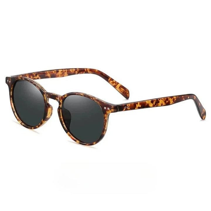 Emma & Rose Manhattan Zelda™ polarized sunglasses with dark tinted lenses and sleek black frame.