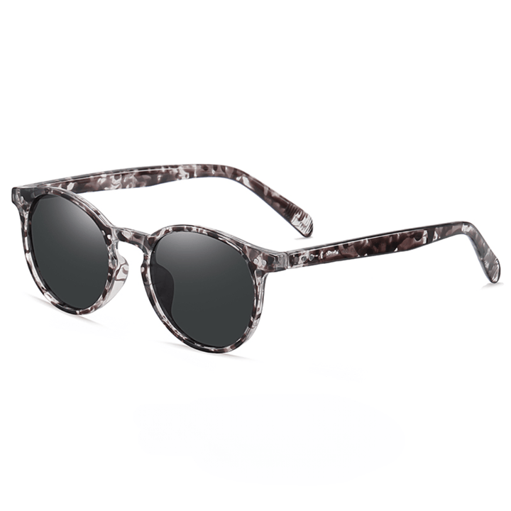 Emma & Rose Manhattan Zelda™ polarized sunglasses with sleek black frames and tinted lenses for stylish eye protection.