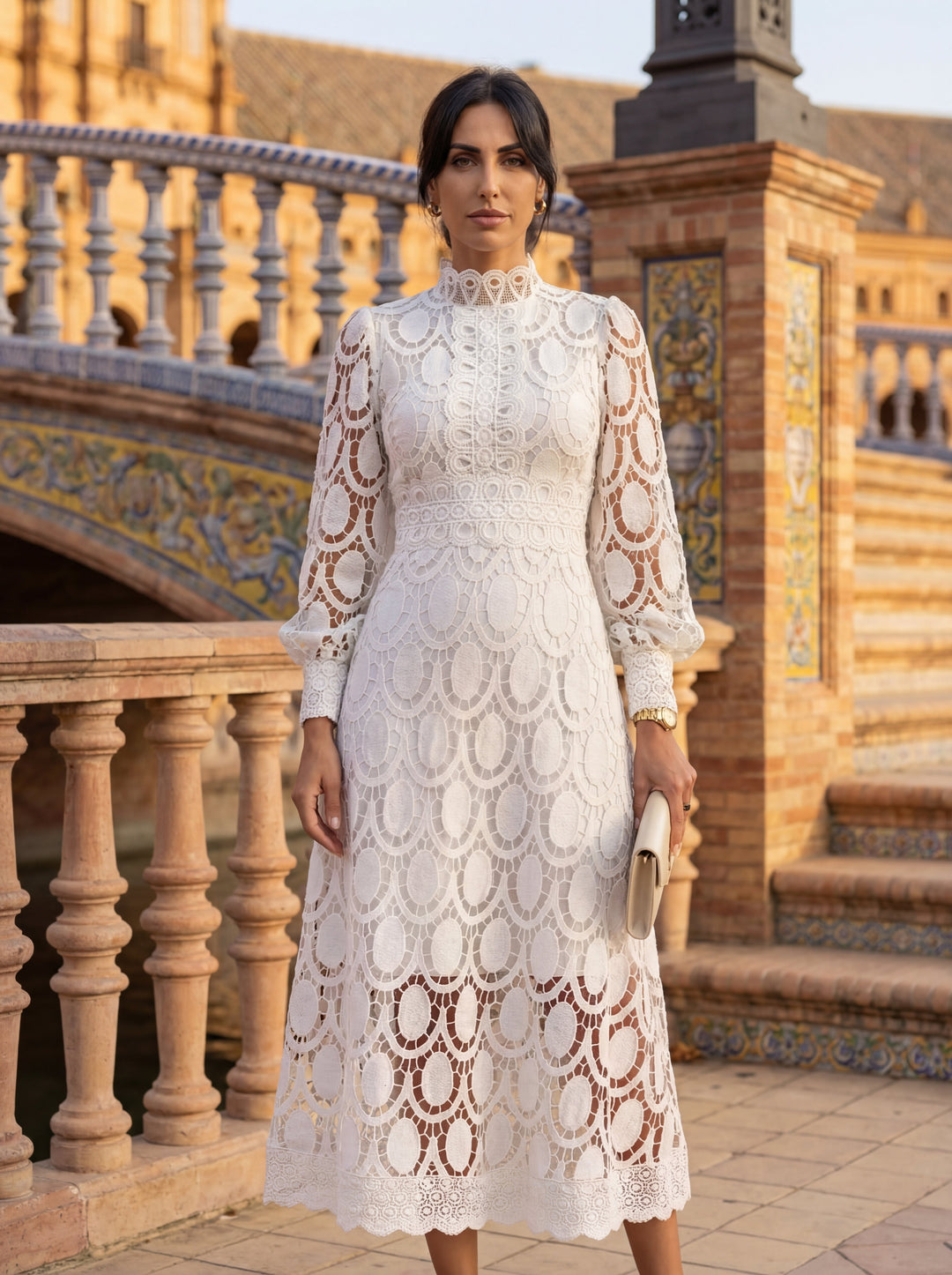 Carmona Spring Lace Dress by Emma & Rose Cape Town displayed on a hanger with detailed lace fabric and floral design.