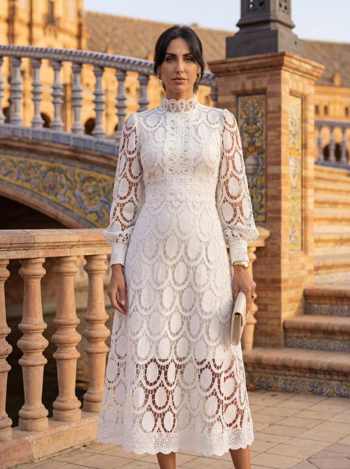 Carmona Spring Lace Dress by Emma & Rose Cape Town displayed on a hanger with detailed lace fabric and floral design.