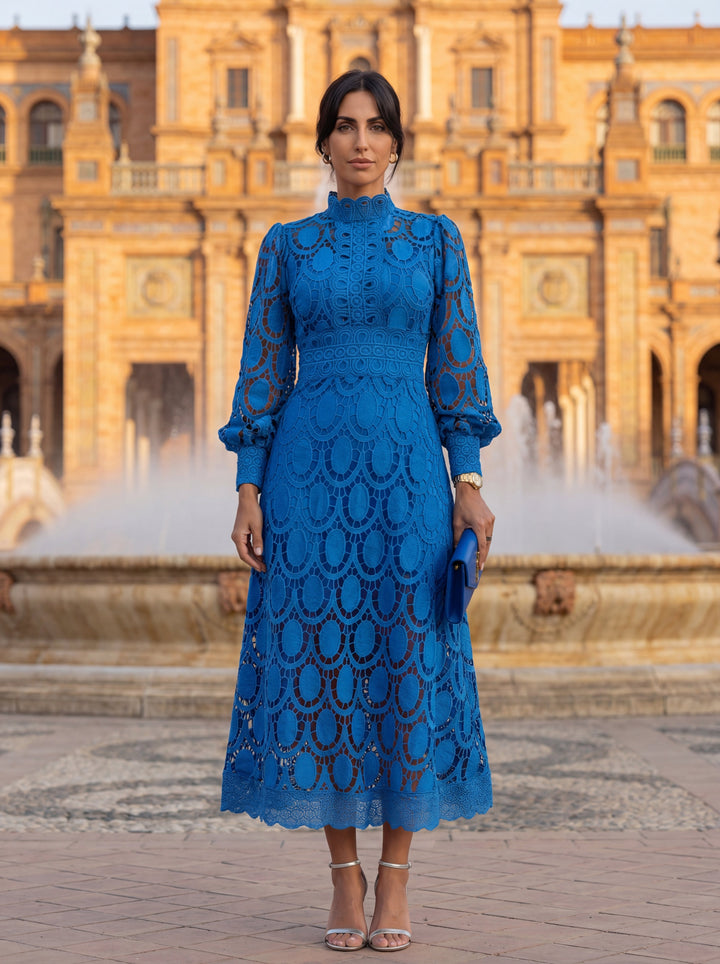 Spring lace dress by Emma & Rose Cape Town featuring floral embroidery and a flowing design.