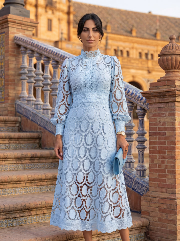 Carmona Spring Lace Dress by Emma & Rose Cape Town displayed on a hanger, featuring delicate lace fabric and floral design.