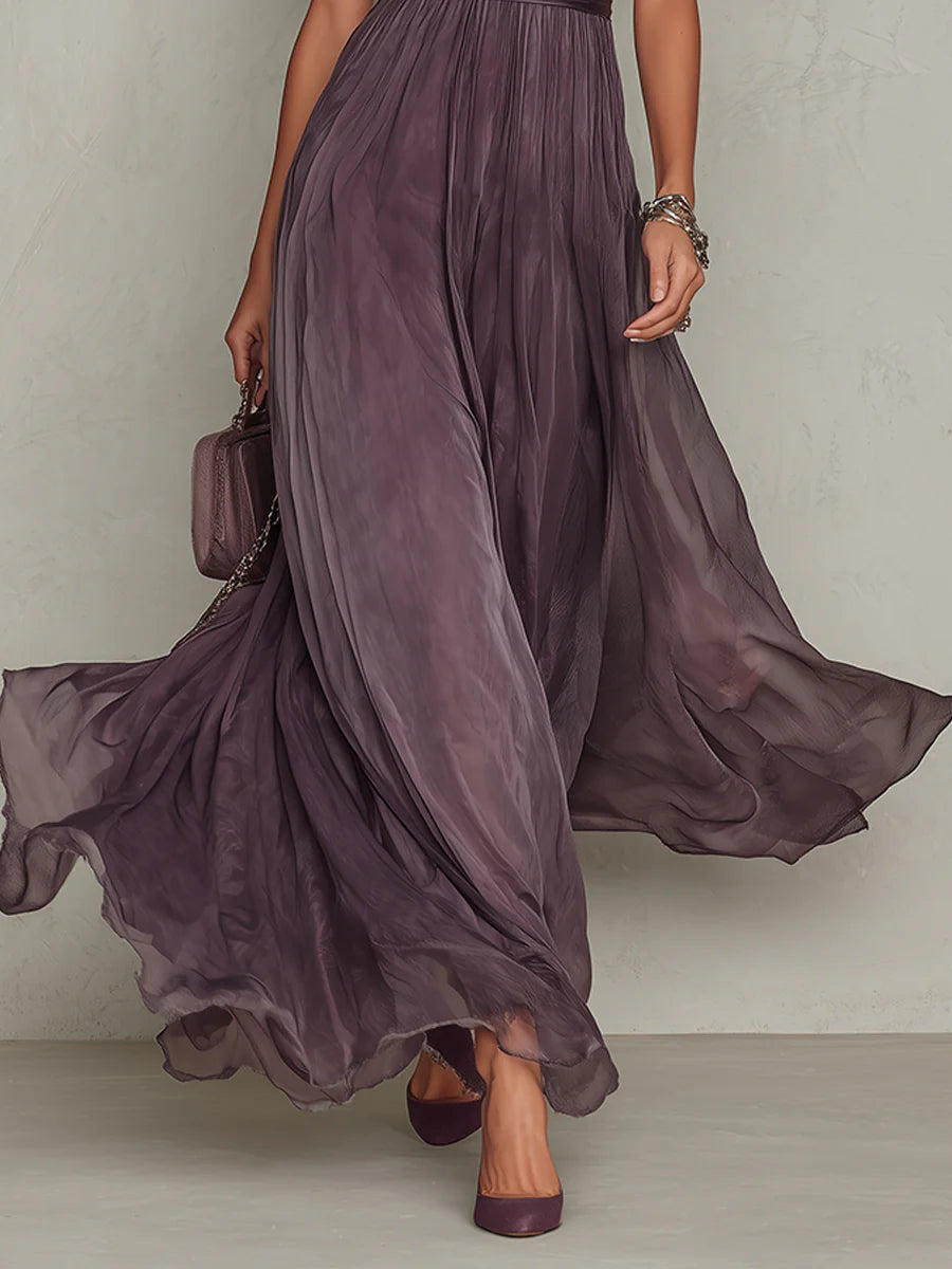 Emma & Rose Cape Town Kelly maxi dress in yellow, flowing fabric with a fitted waist and elegant neckline.