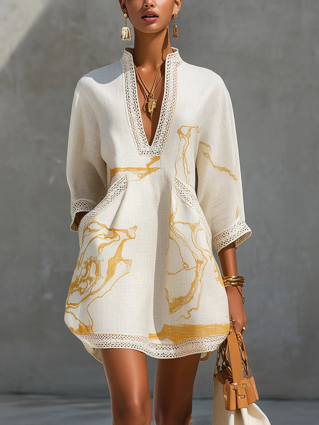 Donatella - Mini black dress with golden marble print and crochet lace
