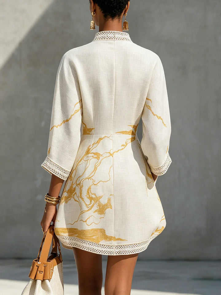 Renata - Short lace dress with gold print and deep V-neck