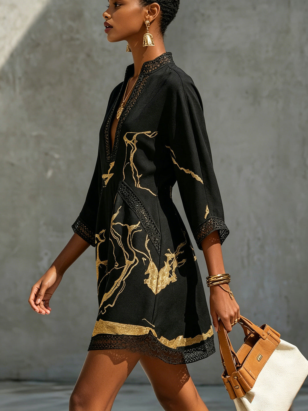 Donatella - Mini black dress with golden marble print and crochet lace