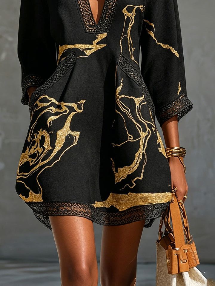 Donatella - Mini black dress with golden marble print and crochet lace