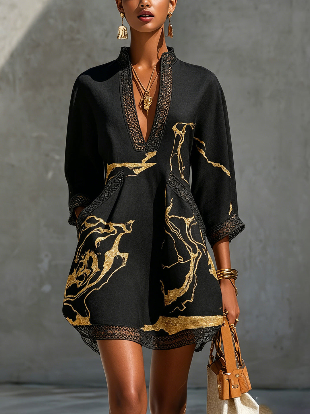Donatella - Mini black dress with golden marble print and crochet lace