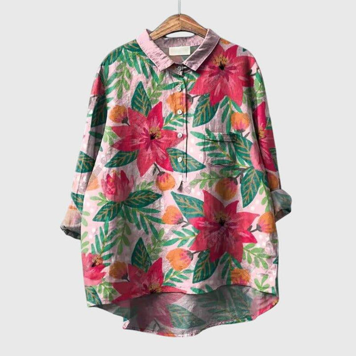 Elegant Linnea™ blouse by Emma & Rose Cape Town, featuring lightweight fabric and classic design, shown on a hanger.