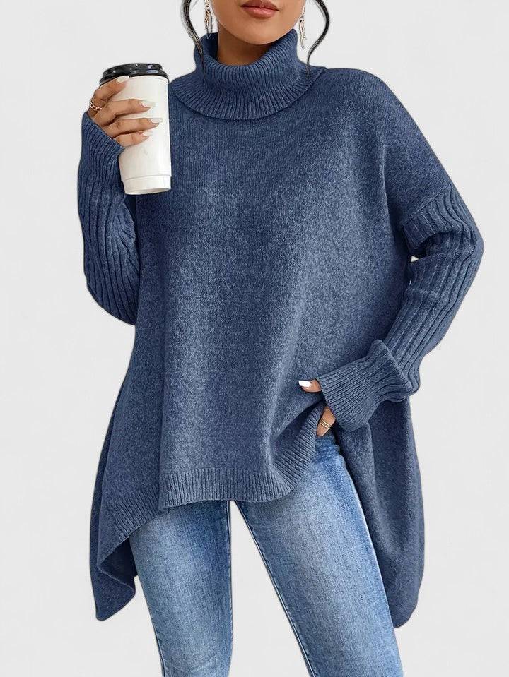 Keiralyss™ Comfortable Sweater by Emma & Rose Cape Town, cozy knit sweater in neutral tones, displayed on a hanger.