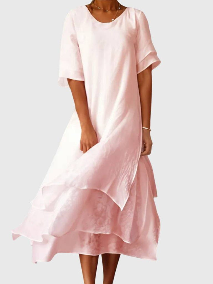 Elegant April™ dress by Emma & Rose Cape Town, featuring a flowing design and intricate detailing, perfect for stylish occasions.